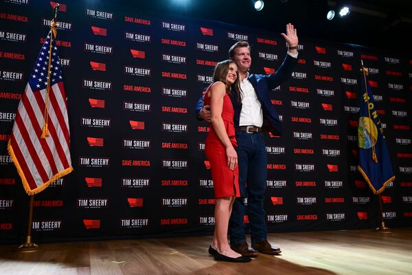 FILE - Republican Montana Senate candidate Tim Sheehy, right, waves to supporters with his wife, Carmen Sheehy, during an election night watch party, Nov. 6, 2024, in Bozeman, Mont. (AP Photo/Tommy Martino, File)