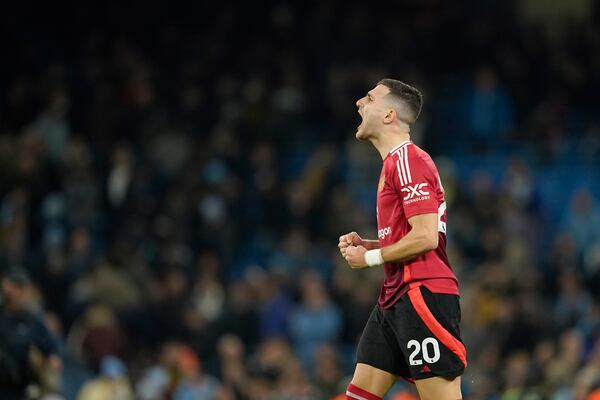 Manchester United's Diogo Dalot reacts during the English Premier League soccer match between Manchester City and Manchester United at the Etihad Stadium in Manchester, Sunday, Dec. 15, 2024. (AP Photo/Dave Thompson)