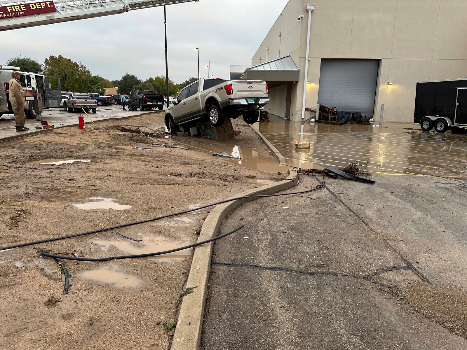 This image provided by Tom Hudgens shows the aftermath of flooding in Roswell, N.M., Monday, Oct. 21, 2024. (Tom Hudgens via AP)