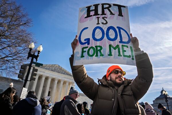 Kyle Lansky, of the organization Transanta, rallies with other supporters of transgender rights by the Supreme Court, Wednesday, Dec. 4, 2024, while arguments are underway in a case regarding a Tennessee law banning gender-affirming medical care for transgender youth. (AP Photo/Jacquelyn Martin)