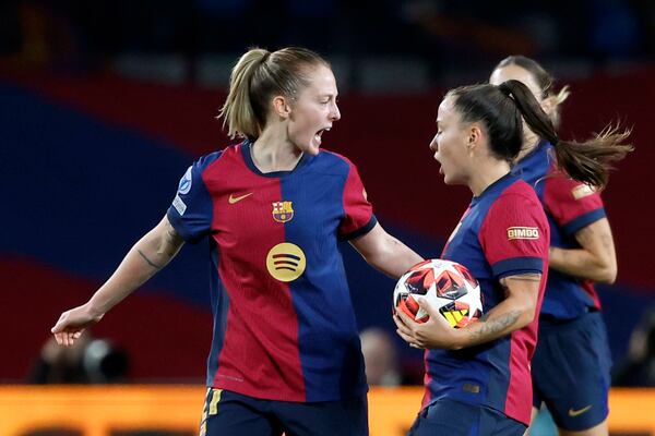 FILE - Barcelona's Keira Walsh, left, congratulates Claudia Pina after scoring during the women's Champions League group D soccer match between FC Barcelona and Manchester City at the Olympic Stadium in Barcelona, Spain, Dec. 18, 2024. (AP Photo/Joan Monfort, File)