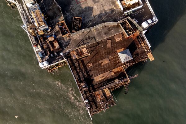 The damaged Santa Cruz Wharf is seen after a section of the pier fell into the ocean during high surf the previous day, in Santa Cruz, Calif., Tuesday, Dec. 24, 2024. (Stephen Lam/San Francisco Chronicle via AP)