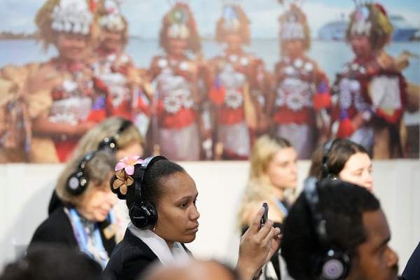 Attendees gather in the Moana Blue Pacific Pavilion at the COP29 U.N. Climate Summit, Monday, Nov. 18, 2024, in Baku, Azerbaijan. (AP Photo/Sergei Grits)