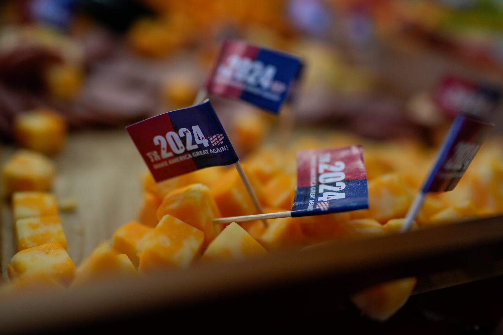 Mini Trump 2024 Make America Great Again toothpicks on a cheese plate are set out for supporters at a rally after Rep. Jim Jordan, R-Ohio, spoke for Rep. Michael Rulli, R-Ohio, at the Mahoning County Republican Party headquarters in Boardman, Ohio, Thursday, Oct. 17, 2024. (AP Photo/Carolyn Kaster)