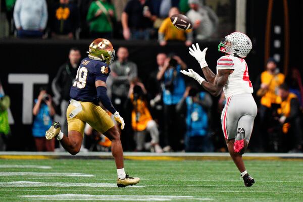 Ohio State wide receiver Jeremiah Smith catches a pass against Notre Dame during second half of the College Football Playoff national championship game Monday, Jan. 20, 2025, in Atlanta. (AP Photo/Jacob Kupferman)