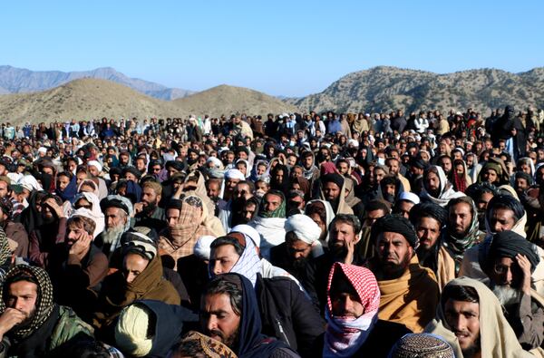 People attend the funeral prayer of Khalil Haqqani, the minister for refugees and repatriation, during his funeral procession in eastern Paktia province, Afghanistan, Thursday, Dec. 12, 2024. (AP Photo/Saifullah Zahir)