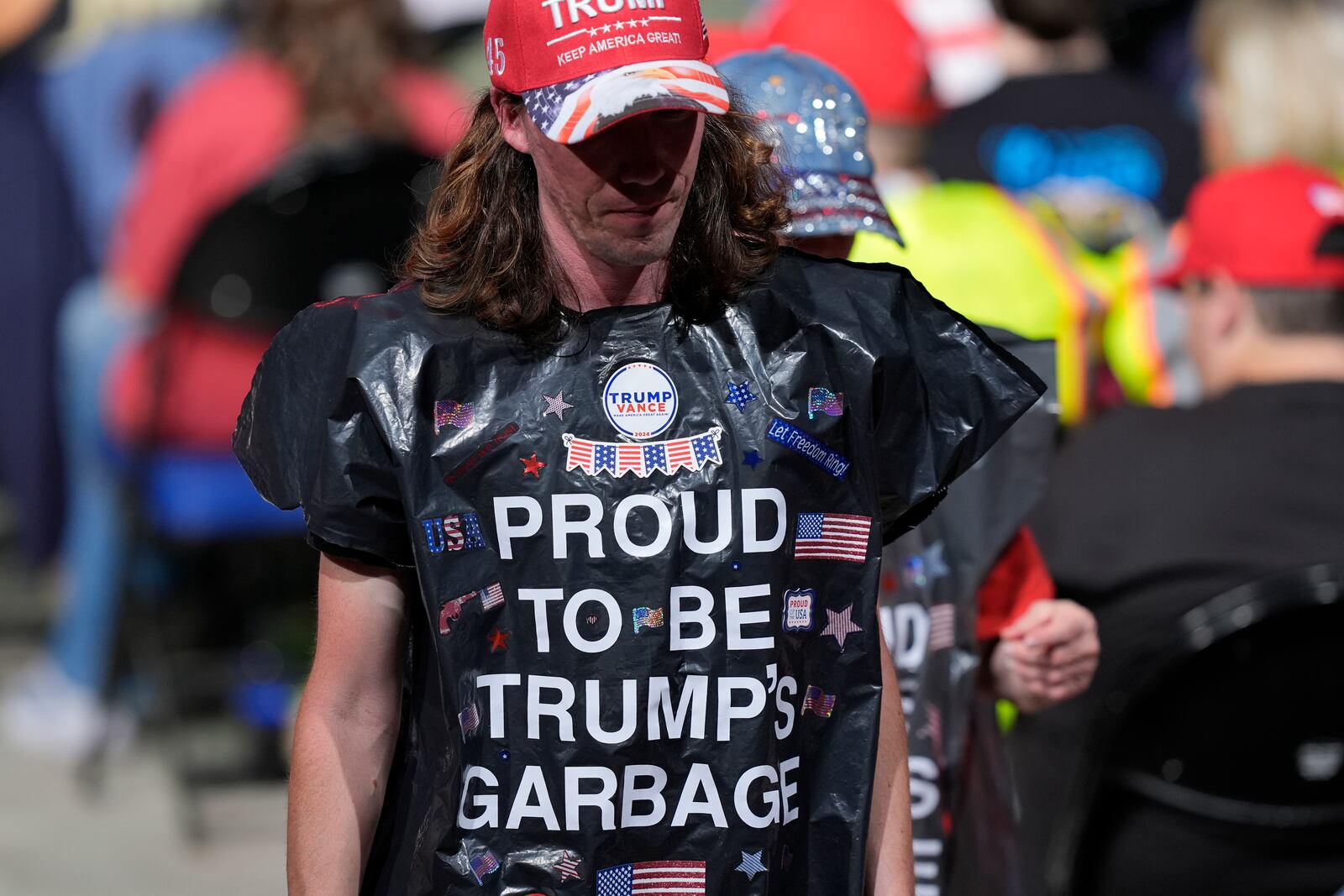 Supporters wearing garbage bags, arrive for a campaign rally for Republican presidential nominee former President Donald Trump, at First Horizon Coliseum, Saturday, Nov. 2, 2024, in Greensboro, NC. (AP Photo/Alex Brandon)