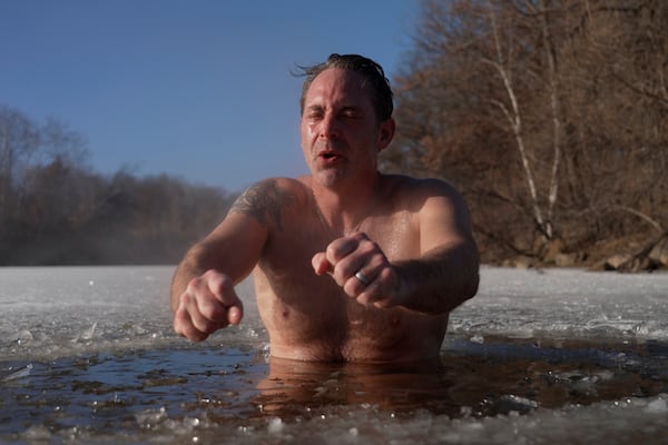 Jeff Tait, of Hastings, Minn., cools off after a session in a Saunable mobile sauna at Lebanon Hills Regional Park in Eagan, Minn. on Sunday, Dec. 1, 2024. (AP photo/Mark Vancleave)