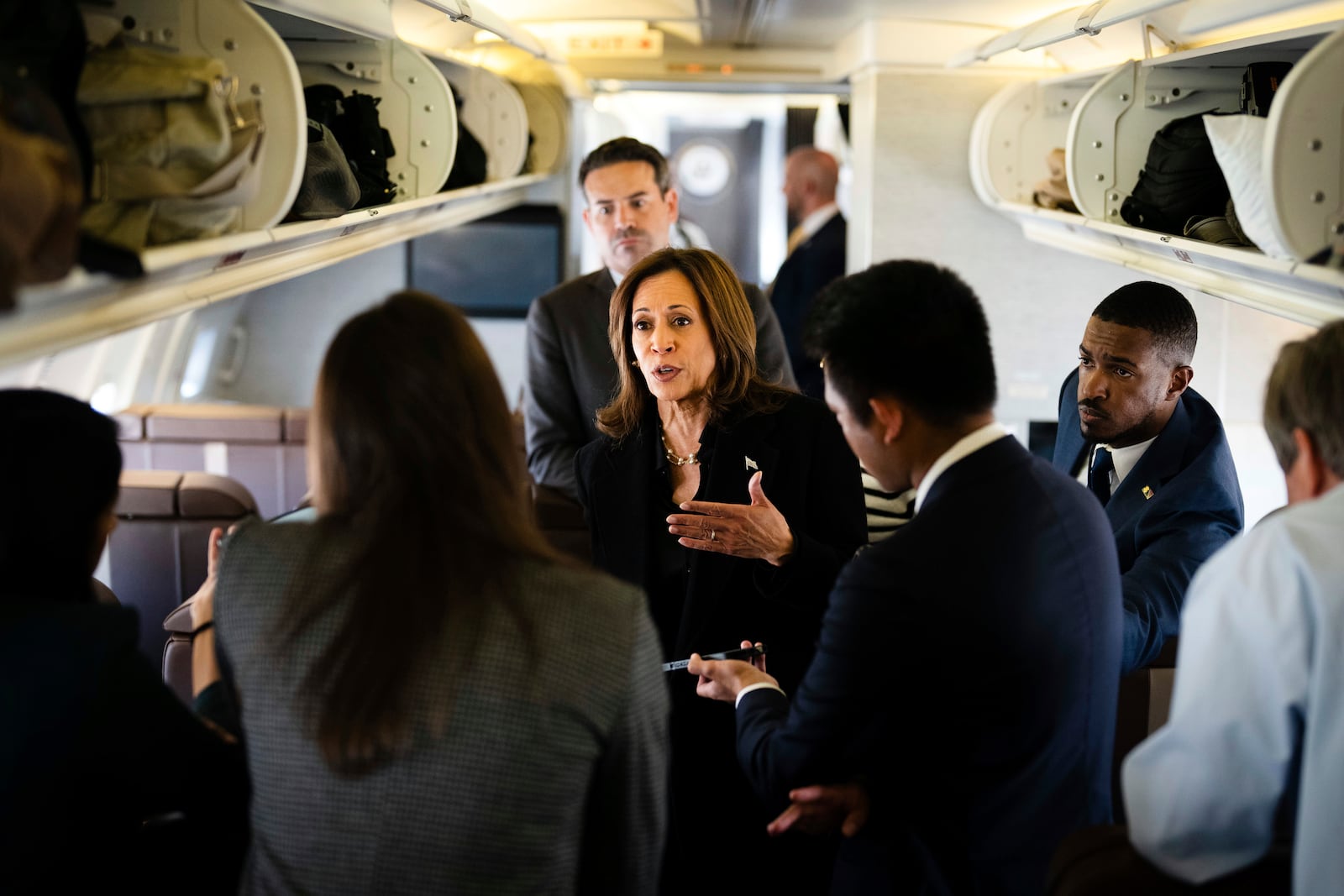 Democratic presidential candidate Vice President Kamala Harris talks to reporters aboard Air Force Two at Joint Base Andrews, Md., Wednesday, Oct. 23, 2024. (Erin Schaff//The New York Times via AP, Pool)