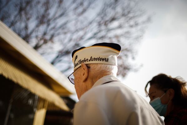 Warren Upton walks with his care giver Eva Martinez, in San Jose, Calif., on Friday, Nov. 26, 2021. (Shae Hammond/Bay Area News Group via AP)