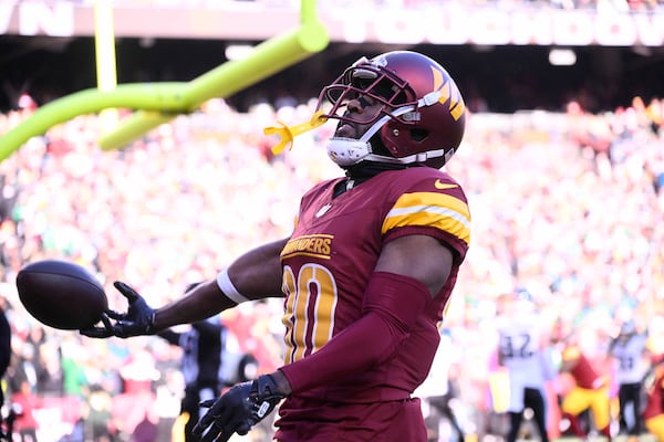 Washington Commanders wide receiver Jamison Crowder (80) celebrates his touchdown against the Philadelphia Eagles during the first half of an NFL football game, Sunday, Dec. 22, 2024, in Landover, Md. (AP Photo/Nick Wass)