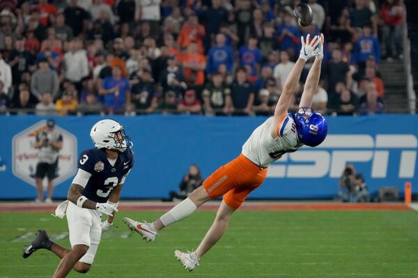 Boise State wide receiver Austin Bolt (81) can't make the catch as Penn State cornerback Jalen Kimber (3) defends during the first half of the Fiesta Bowl NCAA college football CFP quarterfinal game, Tuesday, Dec. 31, 2024, in Glendale, Ariz. (AP Photo/Rick Scuteri)