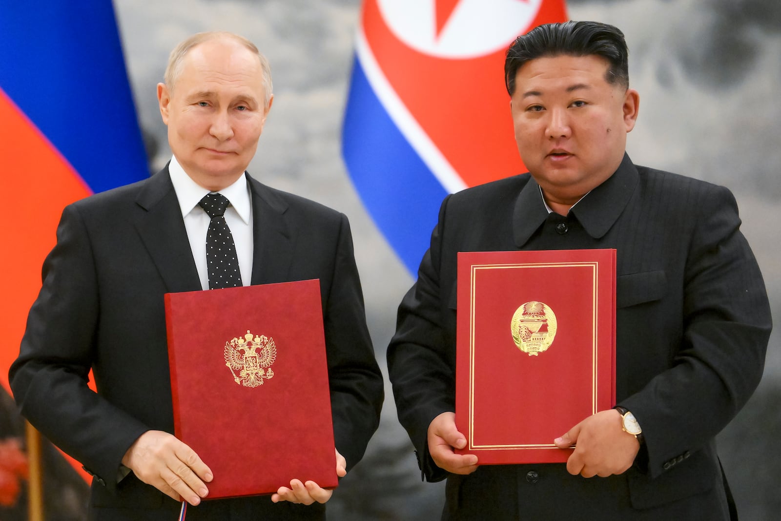 FILE - Russian President Vladimir Putin, left, and North Korea's leader Kim Jong Un pose for a photo during a signing ceremony of the new partnership in Pyongyang, North Korea, on June 19, 2024. (Kristina Kormilitsyna, Sputnik, Kremlin Pool Photo via AP, File)