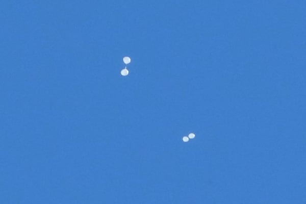 FILE - Balloons carrying what local media reported "trash" are seen in the sky over Seoul, South Korea, on Oct. 2, 2024, as they are also reportedly sent from North Korea. (AP Photo/Ahn Young-joon, File)