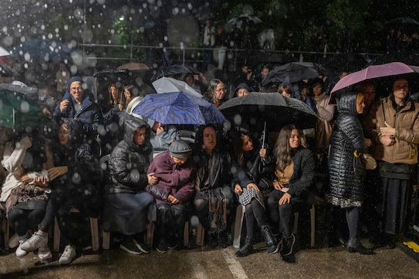 Women listen as a rabbi delivers an eulogy during a ceremony prior to the funeral of Israeli-Moldovan rabbi Zvi Kogan in Kfar Chabad, Israel, Monday Nov. 25, 2024. Kogan, 28, an ultra-Orthodox rabbi, was killed last week in Dubai where he ran a kosher grocery store. Israelis have flocked for commerce and tourism since the two countries forged diplomatic ties in the 2020 Abraham Accords.(AP Photo/Ohad Zwigenberg)