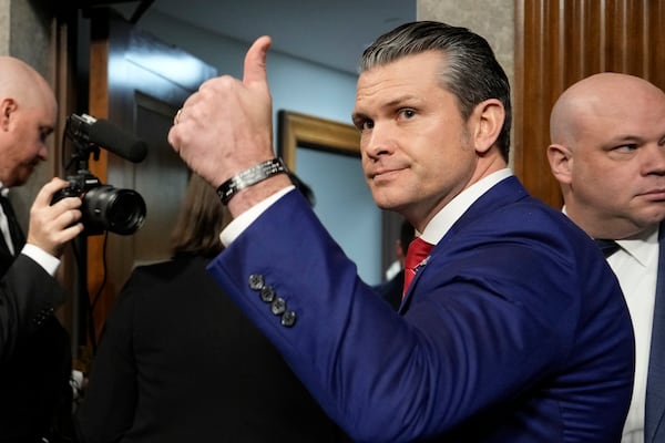 Pete Hegseth, President-elect Donald Trump's choice to be Defense secretary, gives a thumbs-up at the completion of his confirmation hearing before the Senate Armed Services Committee, at the Capitol in Washington, Tuesday, Jan. 14, 2025. (AP Photo/Ben Curtis)