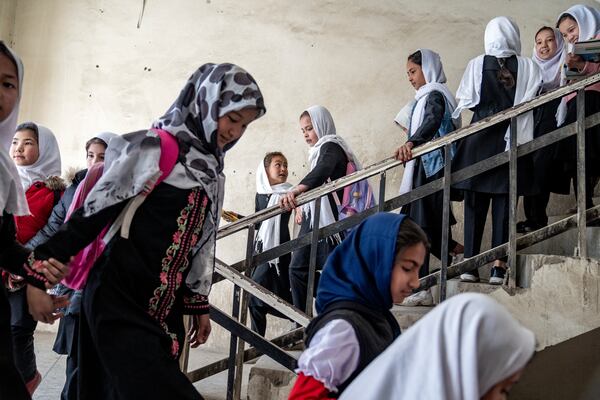 FILE - Girls attend school on the first day of the new school year, in Kabul, Afghanistan, on March 25, 2023. (AP Photo/Ebrahim Noroozi, File)