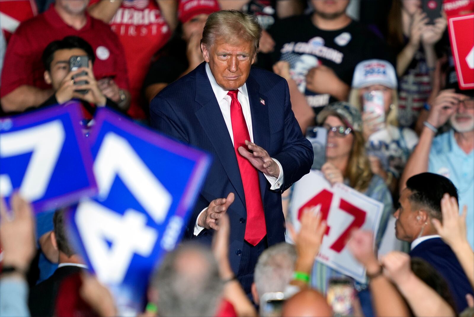 Republican presidential nominee former President Donald Trump gestures to supporters at a campaign rally at Greensboro Coliseum, Tuesday, Oct. 22, 2024, in Greensboro, N.C. (AP Photo/Julia Demaree Nikhinson)