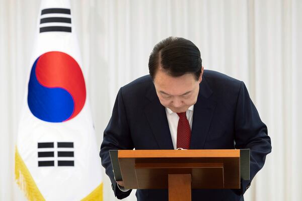 In this photo released by South Korean President Office via Yonhap, South Korean President Yoon Suk Yeol bows while delivering a speech at the presidential residence in Seoul, South Korea, after South Korea’s parliament voted to impeach Yoon Saturday, Dec. 14, 2024. (South Korean Presidential Office/Yonhap via AP)