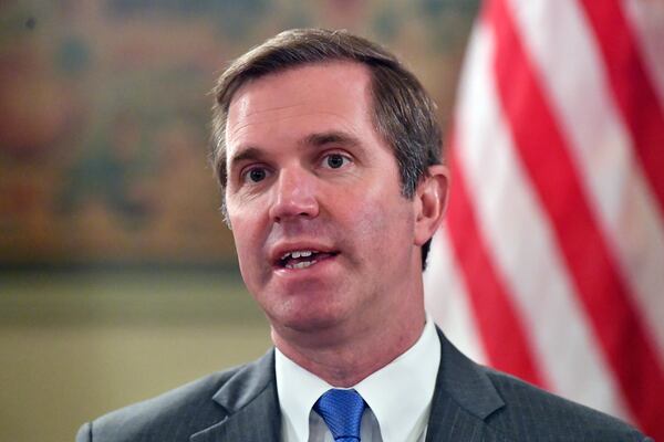 Kentucky Governor Andy Beshear talks about the gains in the economic growth f the state during the past year in Frankfort, Ky., Wednesday, Dec. 18, 2024. (AP Photo/Timothy D. Easley)