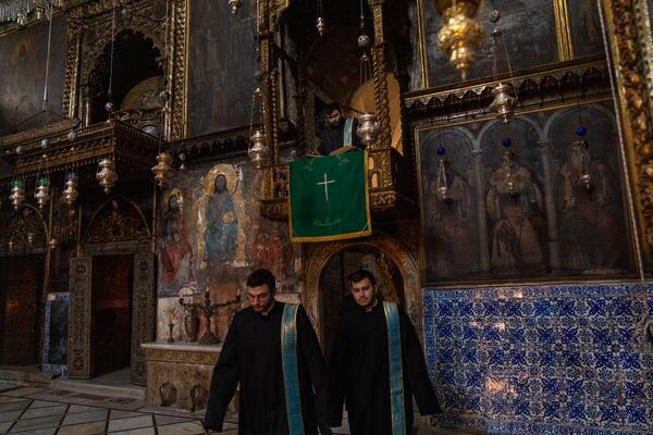 Armenian Christian clergy attend the daily afternoon prayer service at the St. James Cathedral at the Armenian quarter in Jerusalem, Thursday, Nov. 21, 2024. (AP Photo/Francisco Seco)