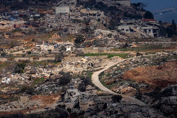 Destroyed buildings in an area of the village of Odaisseh in southern Lebanon, located next to the Israeli-Lebanese border, as seen from northern Israel, Thursday, Jan. 23, 2025. (AP Photo/Ariel Schalit)