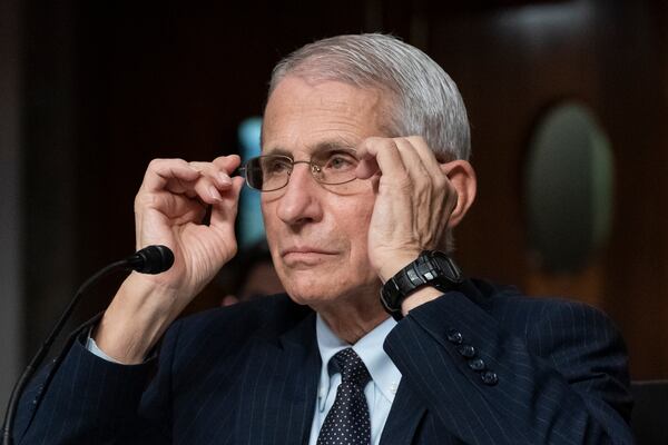 FILE - Dr. Anthony Fauci, director of the National Institute of Allergy and Infectious Diseases, adjusts his glasses during a Senate Health, Education, Labor, and Pensions Committee hearing on Capitol Hill, Nov. 4, 2021, in Washington. (AP Photo/Alex Brandon, File)