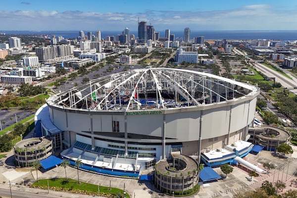 FILE - The roof of the Tropicana Field is damaged the morning after Hurricane Milton hit the region, Oct. 10, 2024, in St. Petersburg, Fla. (AP Photo/Mike Carlson, File)