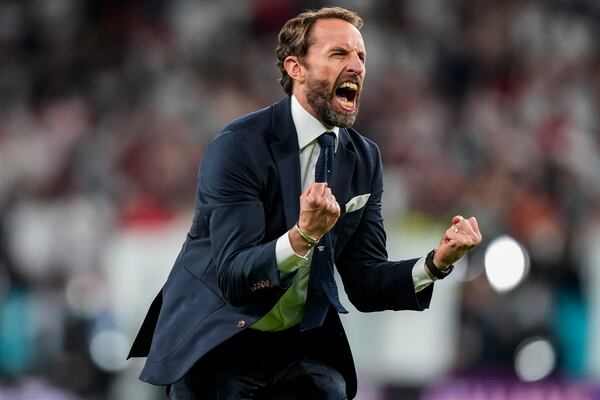 FILE - England's manager Gareth Southgate celebrates after winning the Euro 2020 soccer championship semifinal match against Denmark at Wembley stadium in London, Wednesday, July 7, 2021. (AP Photo/Frank Augstein, Pool, File)