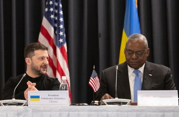 U.S. Secretary of Defense Lloyd Austin, right, and Ukrainian President Volodymyr Zelenskyy attend a meeting of the Ukraine Contact Group at Ramstein Air Base, Germany, Thursday, Jan. 9, 2025. (Marijan Murat/dpa via AP)