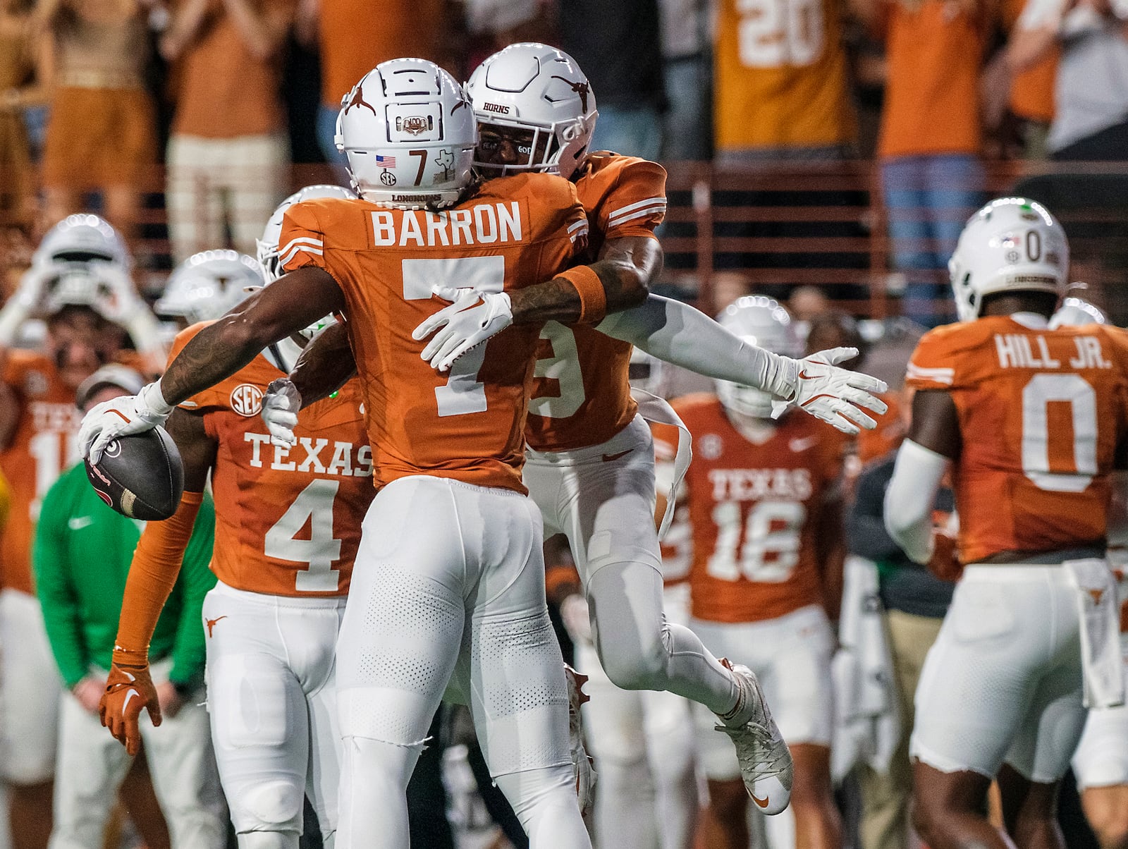 Texas defensive back Jahdae Barron (7) celebrates his interception with Texas defensive back Gavin Holmes (9) during the first half of an NCAA college football game against Georgia in Austin, Texas, Saturday, Oct. 19, 2024. (AP Photo/Rodolfo Gonzalez)