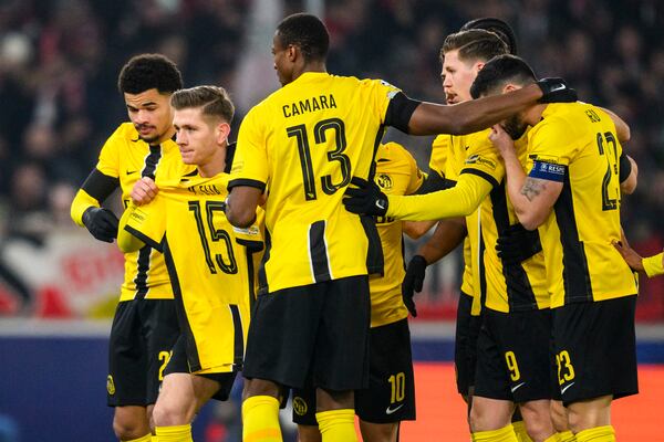 Young Boys' Lukasz Lakomy, second from left, celebrates with teammates after scoring the opening goal during the Champions League opening phase soccer match between VfB Stuttgart and Young Boys in Stuttgart, Germany, Wednesday, Dec. 11, 2024. (Tom Weller/dpa via AP)