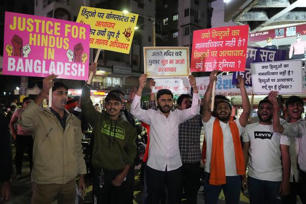 Activists of Bajarang dal, a Hindu rights group, shout slogans during a protest against the alleged attacks on Hindus in Bangladesh, in Ahmedabad, India, Wednesday, Dec. 11, 2024. (AP Photo/Ajit Solanki)