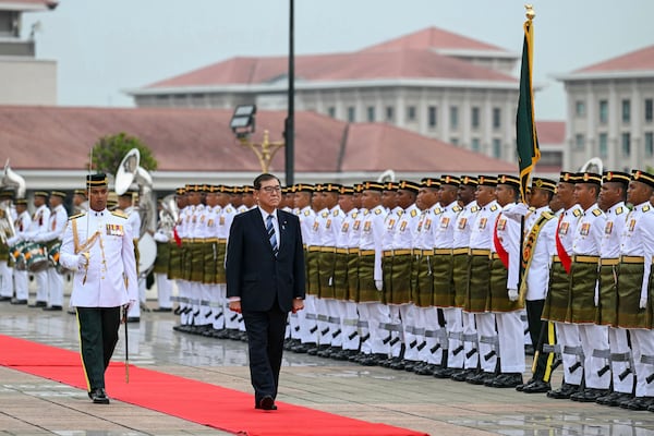 Japan's Prime Minister Shigeru Ishiba inspects a guard of honour during an official visit in Putrajaya, Malaysia, Friday, Jan. 10, 2025. (Mohd Rasfan/Pool Photo via AP)