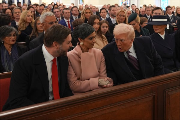 President-elect Donald Trump talks with Vice President-elect JD Vance and Usha Vance before a service at St. John's Church, Monday, Jan. 20, 2025, in Washington, ahead of the 60th Presidential Inauguration. (AP Photo/Evan Vucci)