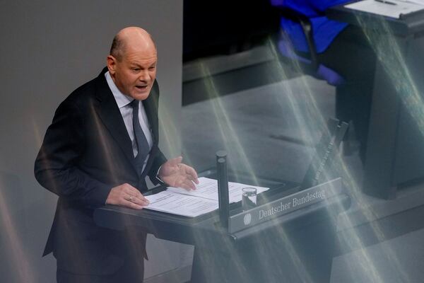 German Chancellor Olaf Scholz speaks during a plenary session at the German parliament Bundestag where he faces a vote of confidence, Berlin, Germany, Monday, Dec. 16, 2024. (AP Photo/Markus Schreiber)