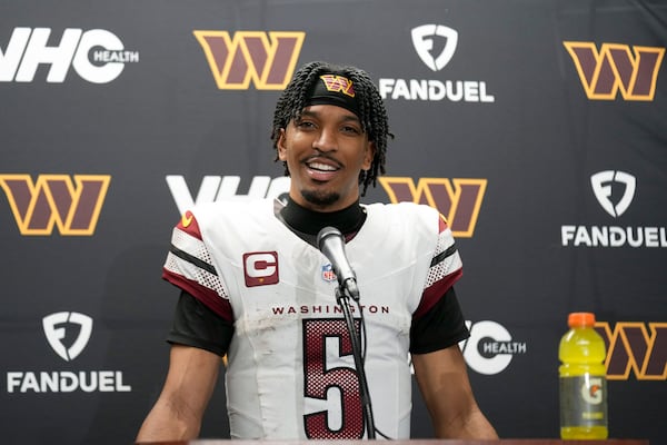 Washington Commanders quarterback Jayden Daniels talks to the media after an NFL football divisional playoff game against the Detroit Lions, Sunday, Jan. 19, 2025, in Detroit. (AP Photo/Seth Wenig)