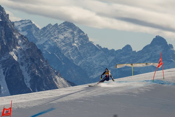 United States' Lindsey Vonn speeds down the course during an alpine ski, women's World Cup downhill training, in Cortina d'Ampezzo, Italy, Thursday, Jan. 16, 2025. (AP Photo/Alessandro Trovati)