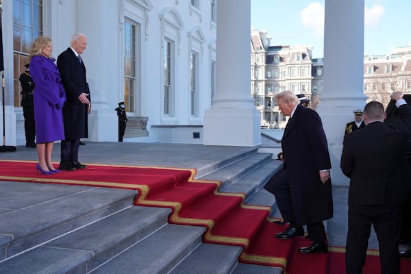 President Joe Biden, center left, and first lady Jill Biden, left, greet President-elect Donald Trump, center right, and Melania Trump, right, upon arriving at the White House, Monday, Jan. 20, 2025, in Washington. (AP Photo/Evan Vucci)