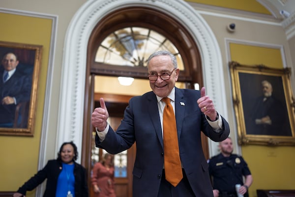 Senate Majority Leader Chuck Schumer, D-N.Y., celebrates as the Senate begins voting on the government funding bill just in time to meet the midnight deadline, at the Capitol in Washington, Friday, Dec. 20, 2024. (AP Photo/J. Scott Applewhite)