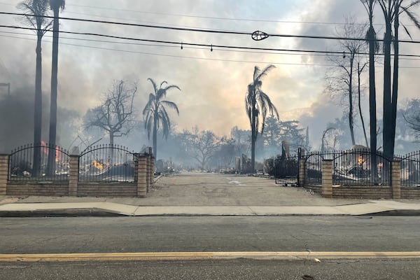 This photo provided by EJ Soto shows the destroyed entrance to the housing development from which her family was forced to evacuate due to wildfire, Wednesday, Jan. 8, 2024, in Altadena, Cali. (EJ Soto via AP)