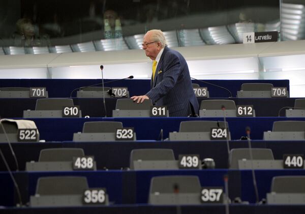 FILE - French former far right National Front leader Jean Marie Le Pen looks for his seat at the European Parliament, in Strasbourg, eastern France, July 1, 2014. (AP Photo/Christian Lutz, File)