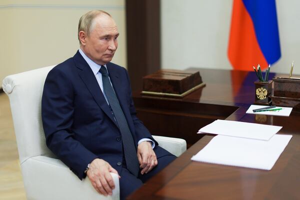 Russian President Vladimir Putin speaks with the head of Russian state space corporation Roscosmos Yuri Borisov during their meeting at Novo-Ogaryovo state residence outside of Moscow, Russia, Friday, Nov. 15, 2024. (Vyacheslav Prokofyev, Sputnik, Kremlin Pool Photo via AP)