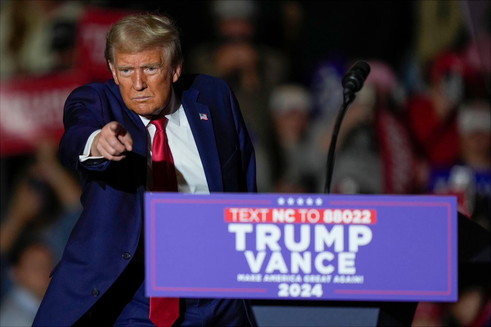 Republican presidential nominee former President Donald Trump gestures after speaking at a campaign rally at Williams Arena at Mignes Coliseum, Monday, Oct. 21, 2024, in Greenville, N.C. (AP Photo/Julia Demaree Nikhinson)