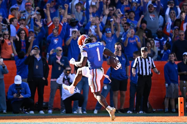 Florida running back Montrell Johnson Jr. (1) rushes for a 9-yard touchdown during the second half of an NCAA college football game against Mississippi, Saturday, Nov. 23, 2024, in Gainesville, Fla. (AP Photo/Phelan M. Ebenhack)