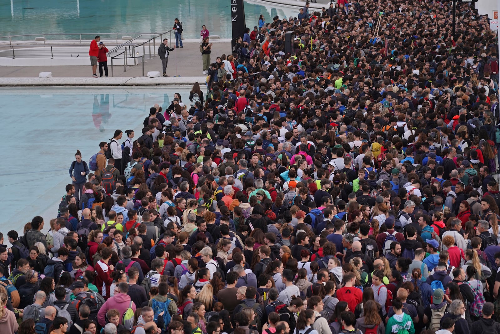 Thousands of volunteers show up at the City of Arts and Sciences cultural complex to be assigned work schedules to help with the clean up operation after floods in Valencia, Spain, Saturday, Nov. 2, 2024. (AP Photo/Alberto Saiz)