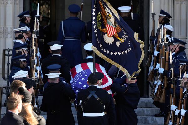 The flag-draped casket of former President Jimmy Carter arrives at Washington National Cathedral in Washington, Thursday, Jan. 9, 2025, for a State Funeral. (AP Photo/Mark Schiefelbein)