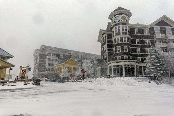 In this photo provided by Snowshoe Mountain Resort, snows covers a village, Friday, Nov. 22, 2024, at Snowshoe Mountain resort in Snowshoe, W.Va. (Kurtis Schachner/Snowshoe Mountain resort via AP)