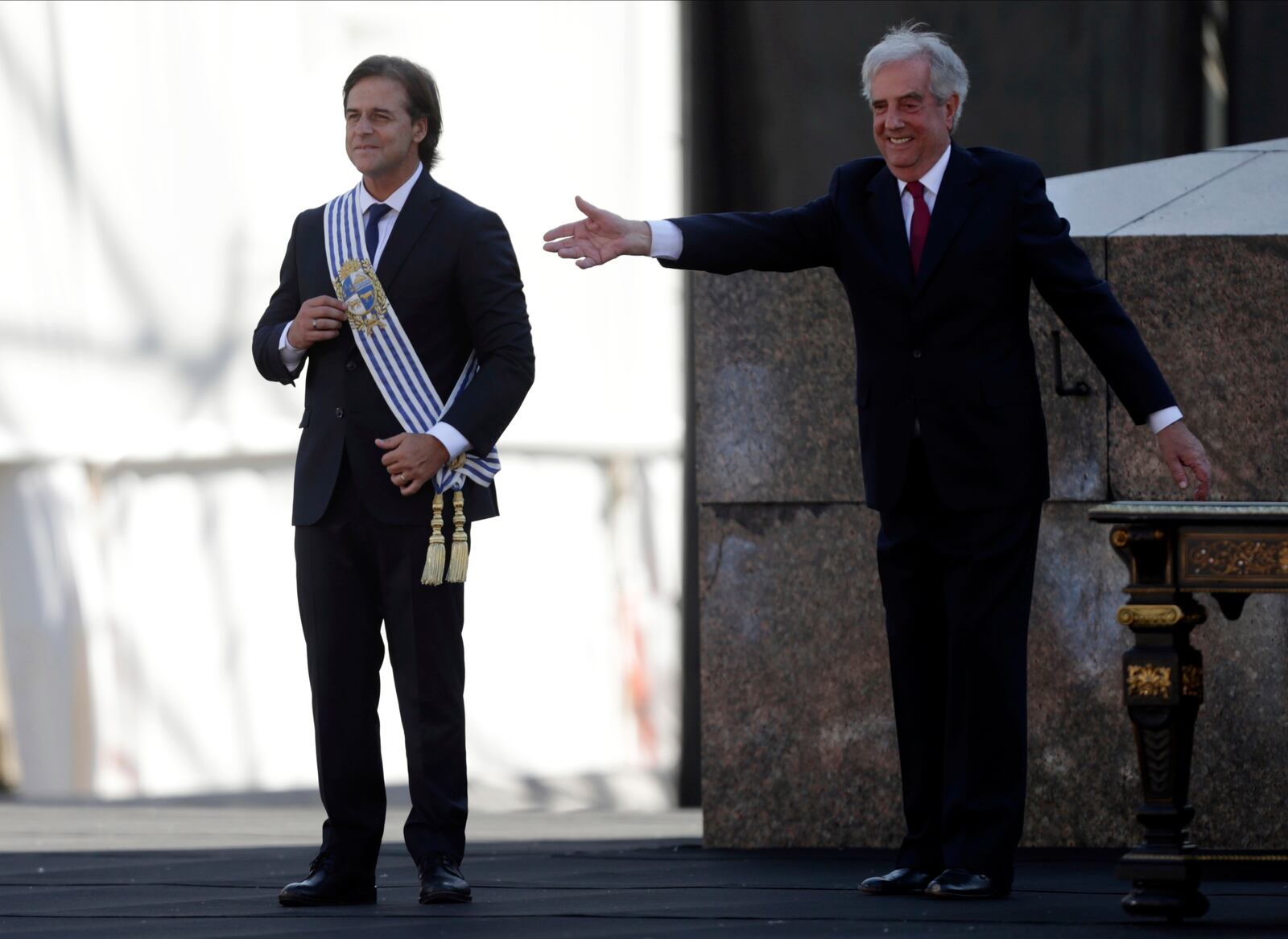 FILE - Uruguay's President Luis Lacalle Pou smiles after receiving the presidential sash from outgoing President Tabare Vazquez, in Montevideo, Uruguay, March 1, 2020. (AP Photo/Matilde Campodonico, File)