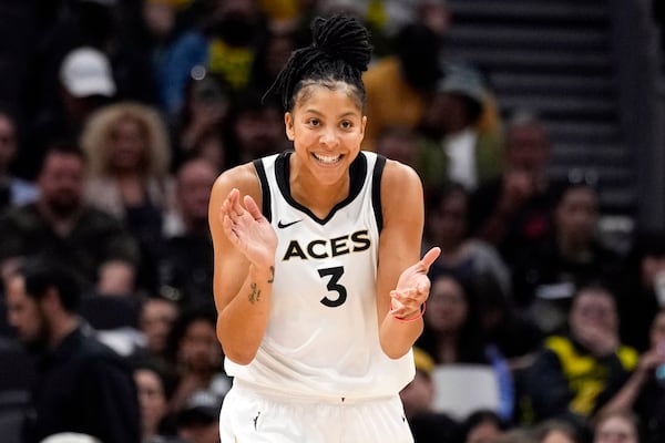 FILE - Former Las Vegas Aces forward Candace Parker reacts during the first half of a WNBA basketball game against the Seattle Storm, May 20, 2023, in Seattle. (AP Photo/Lindsey Wasson, File)